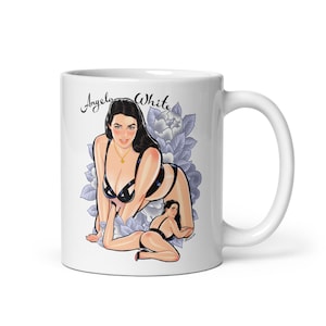May include: White ceramic mug with a black and white illustration of a woman in lingerie with the text "Angela White" printed on the front.