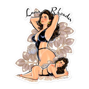 May include: A sticker featuring a pin-up style illustration of a woman in a black swimsuit with the text "Lana Rhoades" above her. The background is a stylized floral design with leaves and roses.