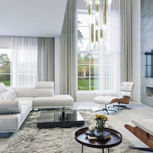 Contemporary living area with large windows, a modern fireplace, and comfortable white seating. Great for modern house plans and townhouse plan enthusiasts.