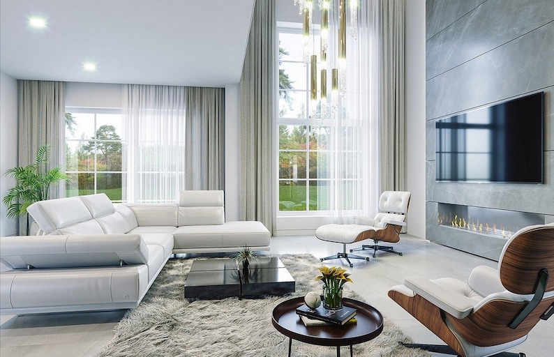 Contemporary living area with large windows, a modern fireplace, and comfortable white seating. Great for modern house plans and townhouse plan enthusiasts.