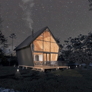 Cozy A-frame house illuminated at night under a starry sky, featuring a glass facade and wooden deck. Perfect for tiny home plans, cottage house designs, or small cabin retreats in tranquil settings.