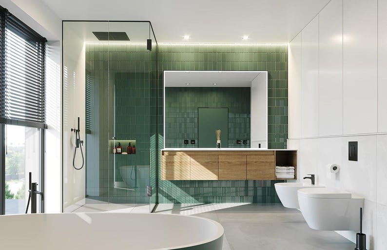 May include: A modern bathroom featuring a green tiled wall, a floating wooden vanity with a white countertop, a large rectangular mirror, a glass-enclosed shower, a white freestanding bathtub, and two white wall-mounted toilets with black fixtures.