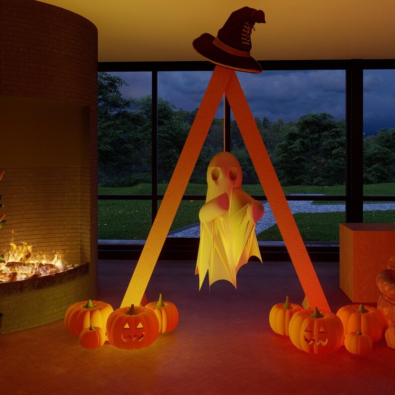May include: A Halloween display featuring a white ghost figure suspended from an orange triangular frame topped with a black witch hat. Several orange jack-o'-lanterns with carved faces are arranged on the floor around the base of the frame.
