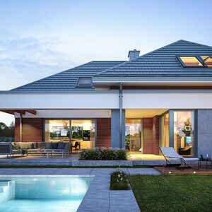 May include: A modern single-story house with a gray tiled roof, white exterior walls, and large glass sliding doors. The home features a covered patio with outdoor seating, a swimming pool in the foreground, and a lawn with glowing spherical lights.