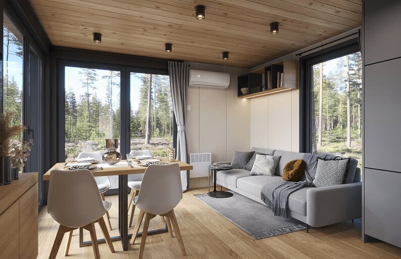 Modern interior design for tiny house plans or small cabin plans, featuring a cozy living area, dining space, and large windows for natural light. Ideal for contemporary cottage house plans with an open and functional layout.