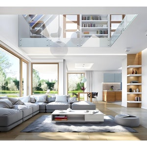 Bright and spacious villa interior with an open-plan design, large windows overlooking a garden, a cozy sectional sofa, and a mezzanine library. Natural light and modern furnishings create a luxurious and inviting atmosphere.