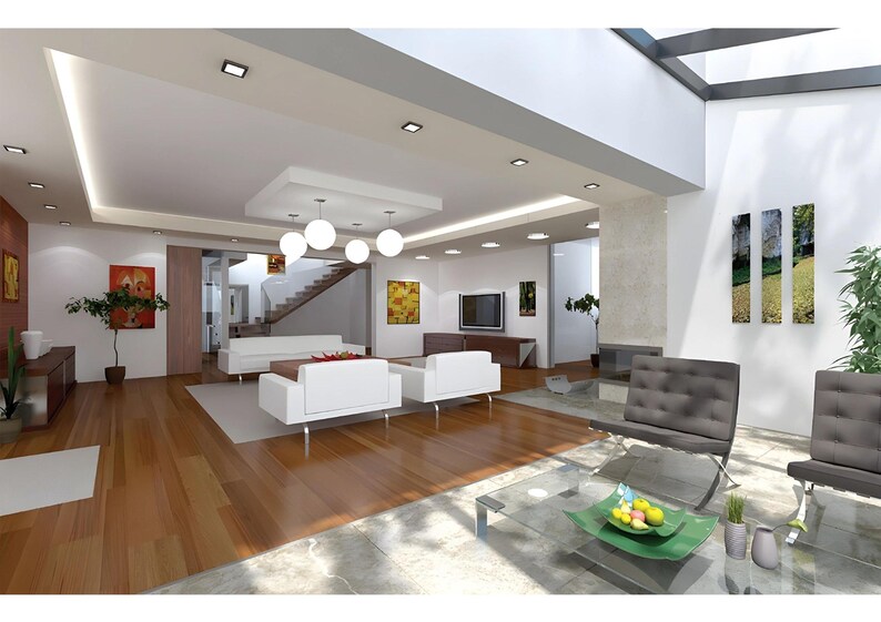 May include: A spacious living room featuring white sofas, two grey tufted chairs, a glass coffee table with a green bowl of fruit, wooden flooring, recessed ceiling lighting, a central pendant light fixture, and various wall art pieces.