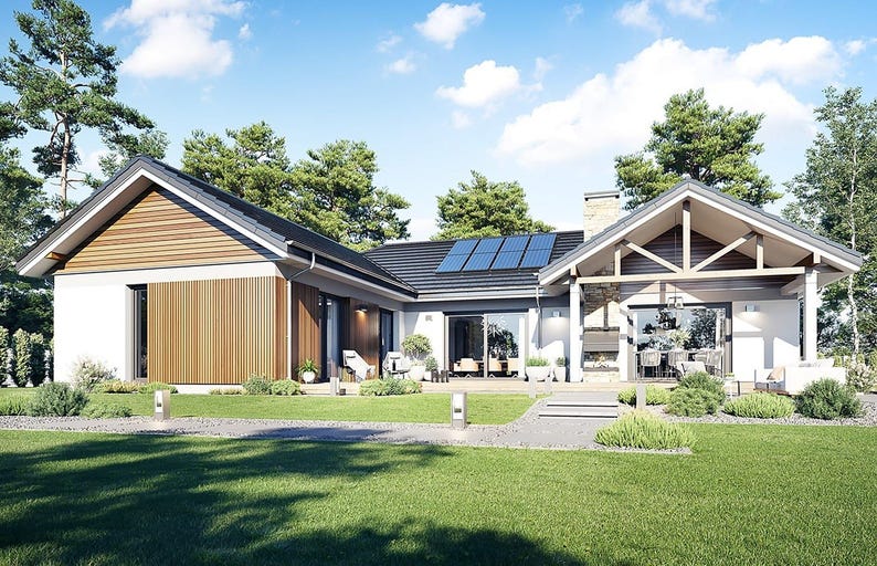 May include: A single-story house with a white exterior, dark roof, and wood-paneled accents. The structure features a covered patio area with exposed wooden beams, a stone chimney, solar panels on the roof, and large glass sliding doors.