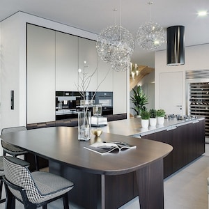 Sleek modern kitchen with a large island, stylish lighting, and an open-plan layout. Ideal for showcasing modern house plans and tiny home plans.