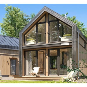 Contemporary wooden cabin with a pitched roof and floor-to-ceiling glass windows. Surrounded by lush greenery, it features a spacious balcony, natural light-filled interiors, and a serene outdoor seating area for relaxation.