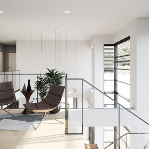 May include: Modern interior design featuring a light-filled space with a staircase and a seating area. Two brown leather chairs with metal legs are positioned near a small side table with decorative vases. The room has large windows with blinds and abstract art.