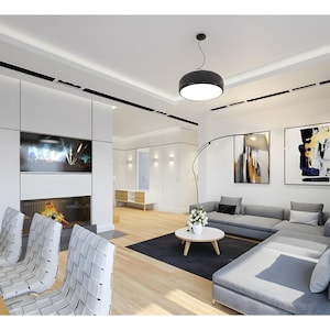 Modern living room with a sectional sofa and contemporary design, suitable for townhouse plan interiors or modern house plans.