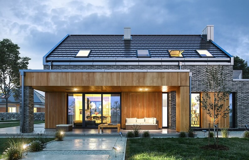 Front view of a modern Scandinavian-style home with large windows and a cozy outdoor area. Perfect for cottage or barndominium house plans.