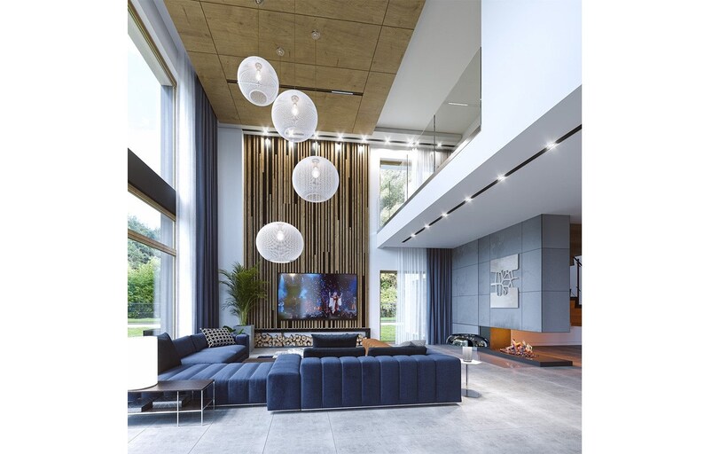Interior shot of a modern living area featuring a blue sectional sofa, a cozy fireplace, and stylish pendant lighting. Great for those inspired by tiny home plans or scandinavian designs.