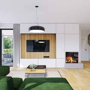 Cozy living room with a fireplace, minimalistic decor, and large windows offering outdoor views, perfect for small cabin plans or modern house interiors.