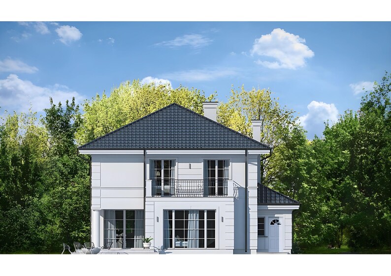 Rear view of a modern two-story house with a balcony, large windows, and a lush garden. Great for modern house plans and townhouse plan enthusiasts.