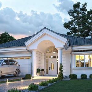 May include: A single-story white house with a dark gray tiled roof, a front porch supported by two white columns, and a white garage door. A silver SUV is parked on the paved driveway in front of the garage, with green lawn and trees.