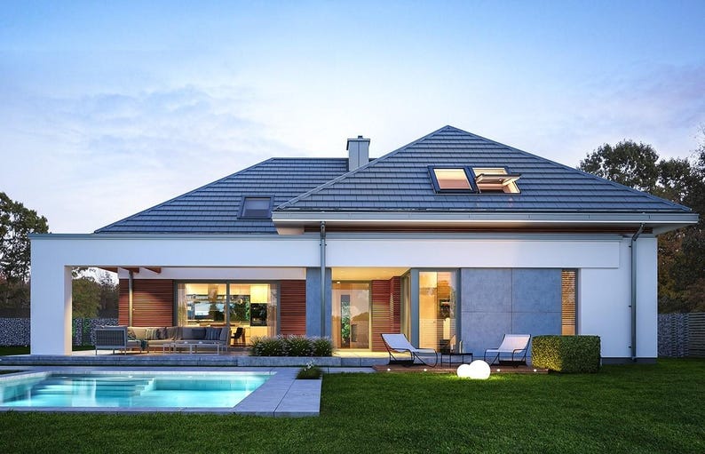 May include: A modern one-story house with a dark gray tiled roof, white exterior walls, and wood paneling accents. The home features a swimming pool, a covered patio with outdoor seating, and a lawn area with two lounge chairs.