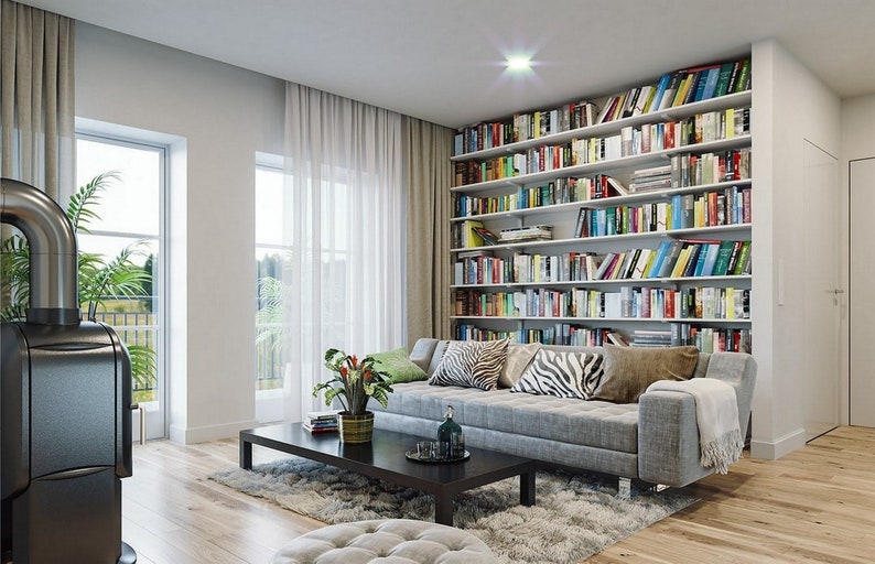 Bright and cozy reading room featuring a large bookshelf, comfortable sofa, and modern decor. Perfect for Scandinavian house plans and tiny home plans.