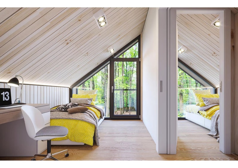 Bright attic bedroom with sloped wooden ceilings, cozy beds, and a study desk. Features large glass doors opening to a serene forest view, blending natural light with a peaceful ambiance.