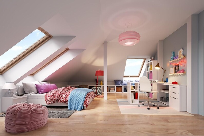 May include: An attic bedroom featuring a bed with a red patterned duvet and blue throw, a pink beanbag chair, a white desk with a rolling chair, a pink pendant light, and skylights. The room includes white furniture, wooden flooring, and wall shelving.