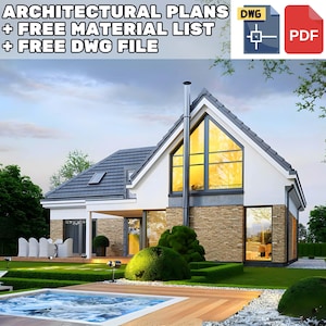 A modern A-frame house design featuring large glass windows and brick cladding, surrounded by a green yard and an outdoor seating area.