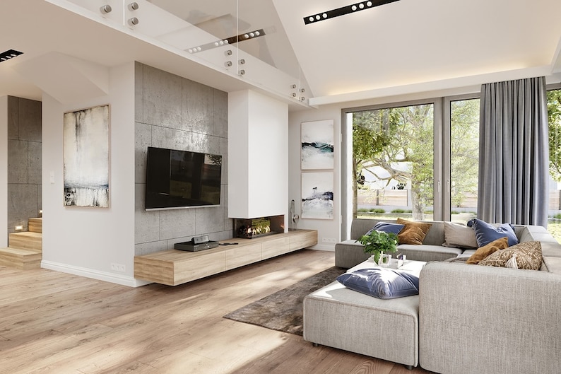 Open-concept living room: An open-concept living room filled with natural light from large windows. Perfect for modern house plans and cottage house plans.
