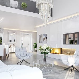May include: A spacious living room featuring white tufted swivel chairs, a round glass coffee table, and a large white sofa. The room includes a built-in white wall unit with integrated shelving, a fireplace, and a crystal chandelier.