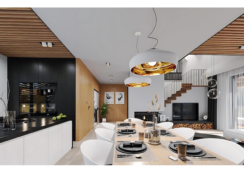 Pu&ograve; includere: Un moderno interno a pianta aperta con una zona pranzo dotata di un lungo tavolo in legno, sedie bianche curve e due grandi lampade a sospensione bianche con interni dorati. La cucina presenta armadietti neri e bianchi.