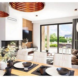 Open living and dining space with floor-to-ceiling glass walls. Ideal for scandinavian house plans fans who appreciate light-filled interiors.