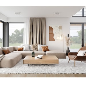 Scandinavian-inspired living room featuring a sectional sofa, textured rug, and natural light pouring in from large windows. Perfect for modern house plans with open-concept interiors.