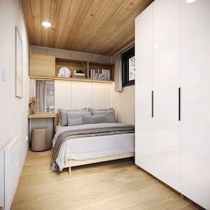 Elegant bedroom design for tiny house plans or small cabin layouts, featuring a cozy bed, built-in storage, and minimalist decor. Perfect for maximizing functionality in modern cottage house plans or barndominium plans.