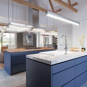 May include: A modern kitchen featuring two large islands with matte navy blue cabinetry and white marble countertops. One island includes a white sink with a chrome faucet. A tall wine refrigerator is built into the white wall cabinetry.