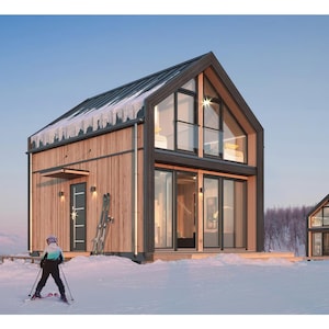 Modern wooden cabin with large glass windows and a pitched roof, set in a snowy landscape. Features warm interiors, outdoor ski storage, and a cozy balcony, ideal for winter retreats and mountain living.
