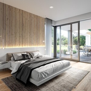 May include: A bedroom featuring a low-profile white bed with gray and white bedding, positioned against a wall with vertical wood slats and integrated lighting. A floating white nightstand, a gray area rug, and floor-to-ceiling windows.