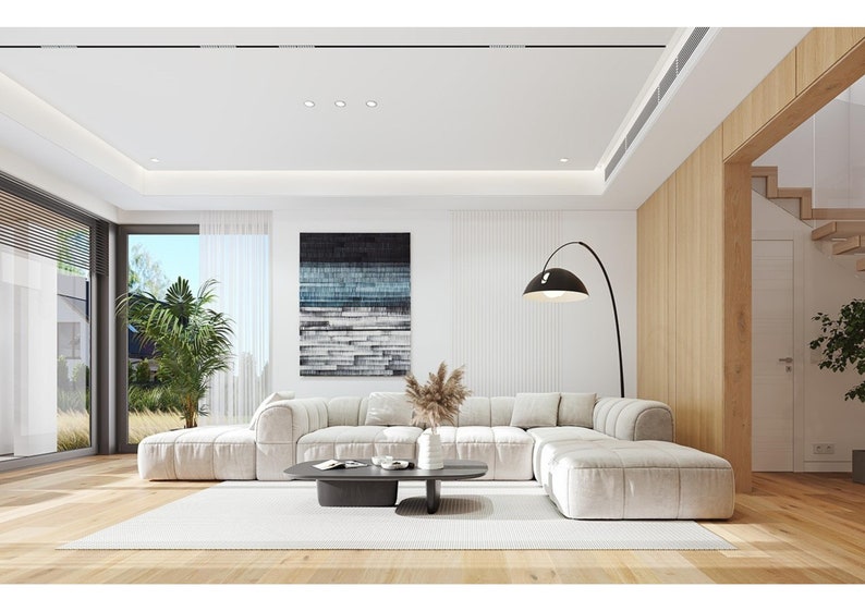 Spacious living room with a white sectional sofa, wooden accents, and natural light streaming in, an essential part of modern house plans and villa designs