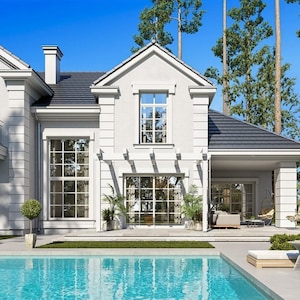 Elegant backyard view of a luxurious home with large windows, a swimming pool, and outdoor seating area. Suitable for modern house plans and cottage house plans.