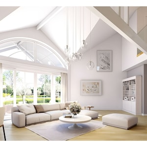 Bright and spacious modern interior design with vaulted ceilings, large windows, and open living space. Ideal for cottage house plans or modern house plans focusing on natural light and minimalistic elegance. Perfect for contemporary living.