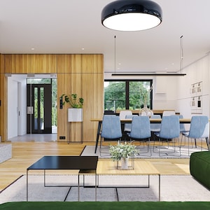 Open-concept living and dining area with Scandinavian-inspired decor, wooden accents, and natural light, ideal for modern house plans or tiny home designs.