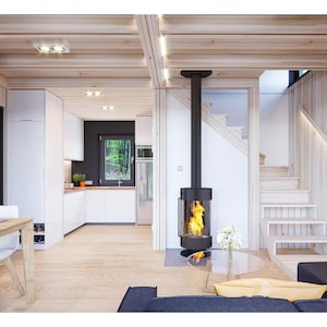 Cozy modern interior with a wood-paneled design, featuring a central fireplace, open kitchen, and staircase leading to the upper level. Warm tones and natural light create a welcoming and functional living space.