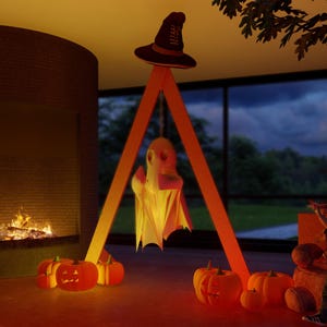 May include: A tall orange triangular wooden frame stands on the floor, supporting a hanging white ghost figure. A dark brown witch hat sits atop the frame. Several orange jack-o'-lanterns with glowing carved faces are arranged at the base.