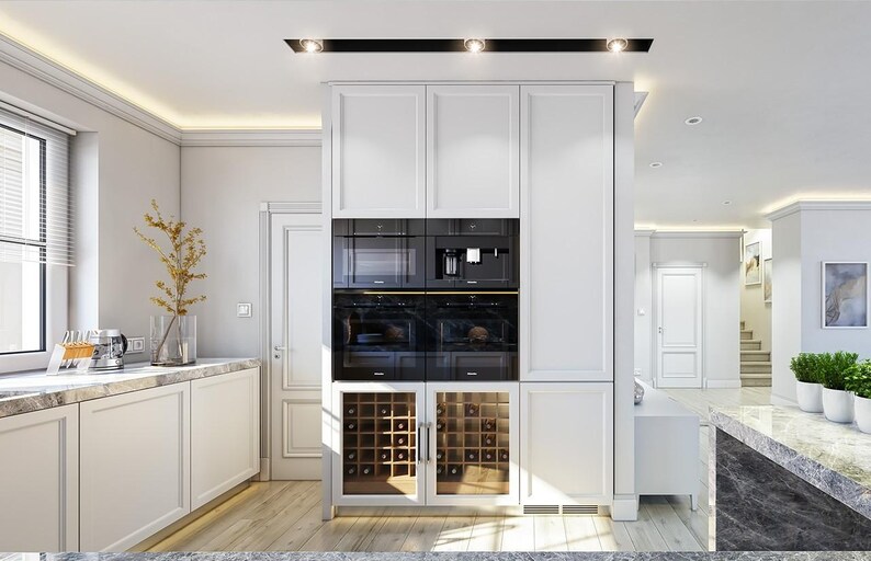 May include: A white kitchen cabinetry unit featuring a central column with two stacked black built-in ovens, a microwave, and a coffee machine, positioned above two glass-fronted wine storage compartments with wooden racks and interior lighting.