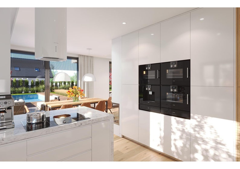 Sleek kitchen with built-in appliances, white cabinets, and a marble countertop overlooking the pool area, great for open-concept floor plans in modern homes