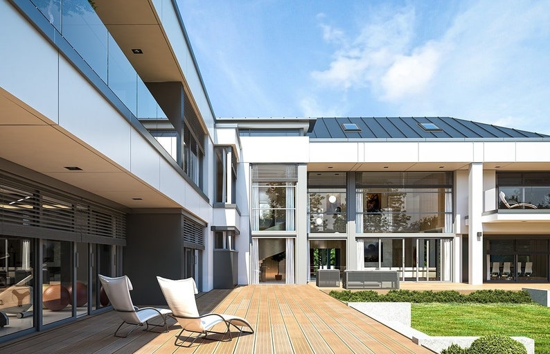 A close-up of a contemporary house's backyard showcasing a spacious patio, glass railings, and sleek architectural lines. Great for modern house plans.