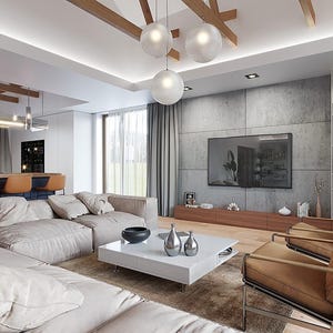 May include: A living room featuring a large beige sectional sofa, a white square coffee table with silver vases, and two tan leather armchairs. The room includes a concrete wall with a mounted television, wooden ceiling beams, and globe pendant lights.