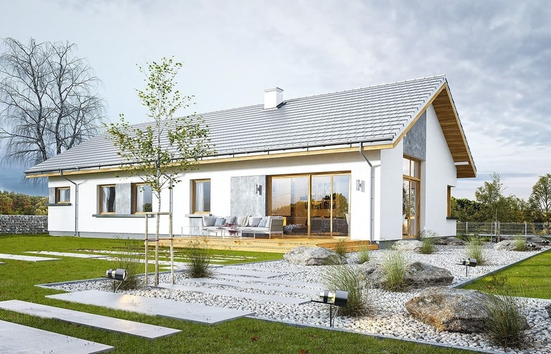 Side view of a modern Scandinavian home with a gray gable roof, white walls, and a lush green forest background. Perfect for showcasing cottage house plans, modern villa layouts, or small cabin inspirations.