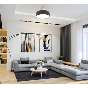 Bright and airy living space with large windows and Scandinavian-style decor, ideal for those exploring plan maison or small cabin plans.