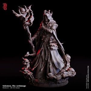 May include: A detailed figurine of Solomon, The Archmage, a character from the Spellbound Apocalypse series. The figure is dressed in a hooded robe and holds a staff with a glowing orb. The base is 25 mm. The color scheme is dark with red accents.