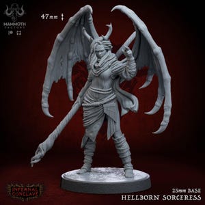 May include: Gray plastic miniature figurine of a female demon with wings, horns, and a staff. The figurine is standing on a round base. The text "Hellborn Sorceress" and "25mm Base" are printed below the base.