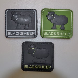 May include: Three square patches with a cartoon black sheep design. Each patch has the word "BLACKSHEEP" in a rectangular box at the bottom. The patches are in gray, green, and black.